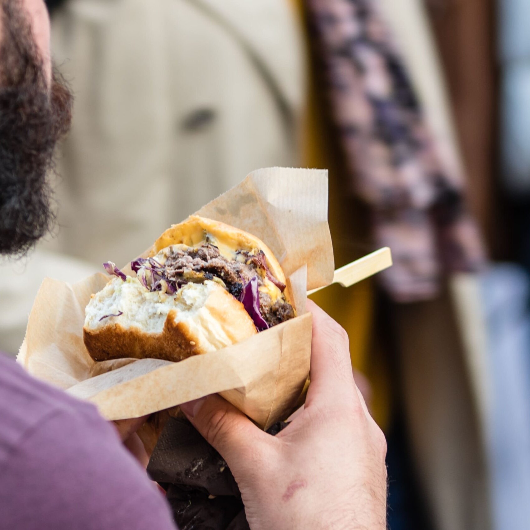 midsection-man-holding-burger